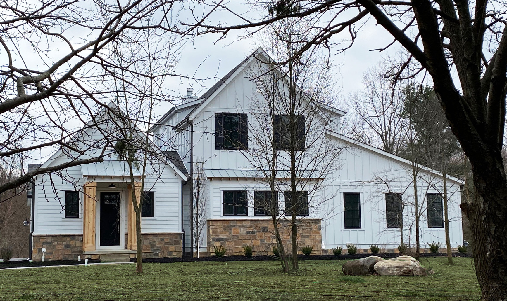 The Buxton front elevation in snow by The Tuckerman Home Group